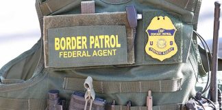 Border Patrol vest with gear and communication equipment.