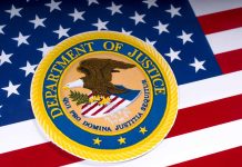 Department of Justice emblem on the American flag.