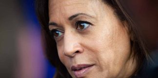 Woman with brown hair and thoughtful expression.