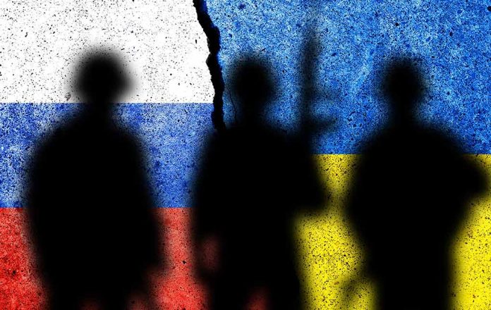 Silhouettes against split Russian and Ukrainian flags.