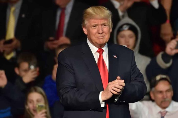 Man in suit clapping at public event.