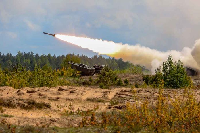 Military tank firing a missile in forest area.