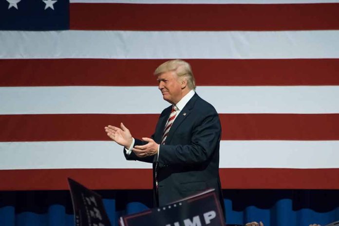 Man clapping near American flag at event