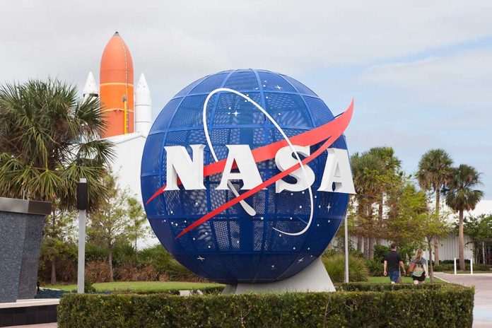 Blue NASA globe with rocket in background.