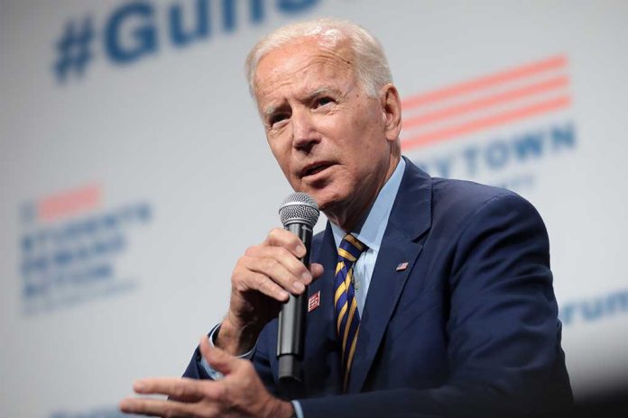 Man in suit speaking into microphone at event