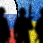 Silhouettes against Russian and Ukrainian flag background crack