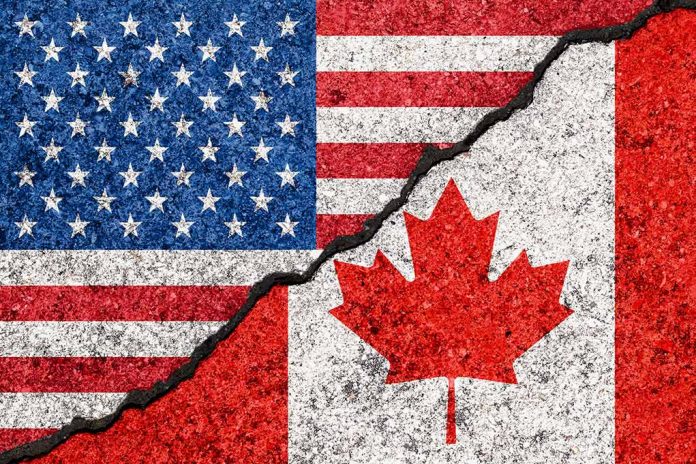 USA and Canada flags divided by jagged crack