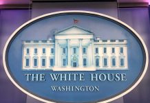 The White House emblem with blue background.