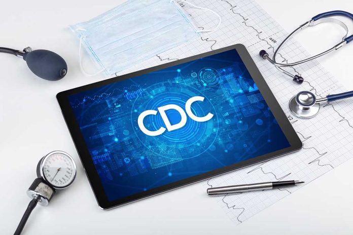 Tablet with CDC logo surrounded by medical equipment