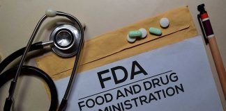 Stethoscope and FDA documents with pills and pen
