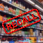 Recall notice over blurred store shelves