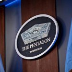 Pentagon Washington emblem with flags in background