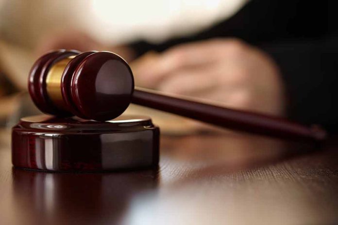 Gavel resting on a wooden sound block