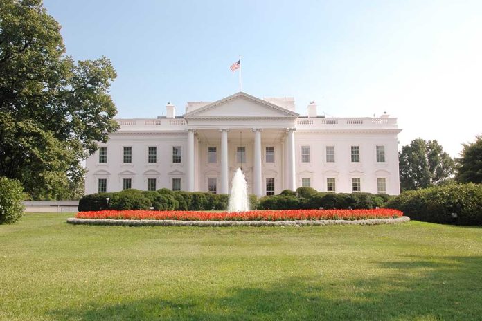 92422096 featured image White building with columns fountain and garden in front