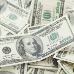 Multiple US one hundred dollar bills