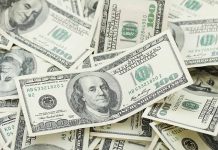 Multiple US one hundred dollar bills
