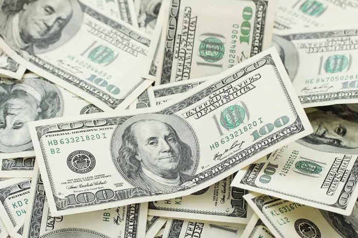 150954545 featured image Multiple US one hundred dollar bills