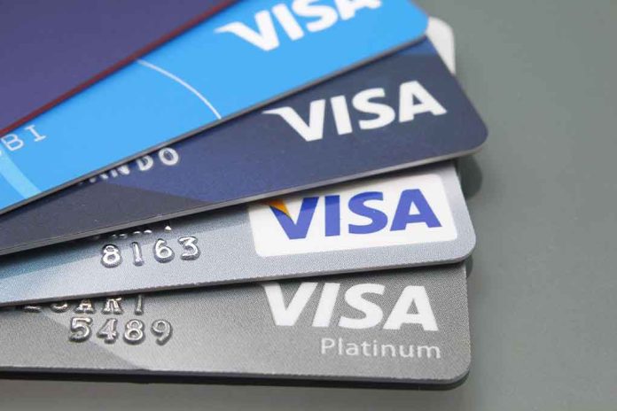 1699083310 featured image Stacked Visa credit cards in various colors.