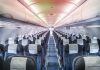 Empty airplane cabin with rows of seats