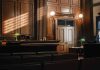 Empty courtroom with judges bench and wooden decor