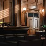 Empty courtroom with judges bench and wooden decor