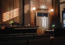Empty courtroom with judges bench and wooden decor