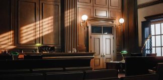 Empty courtroom with judges bench and wooden decor