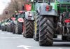 Tractors lined up on a city street