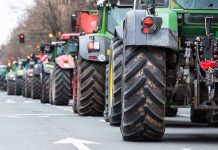 Tractors lined up on a city street