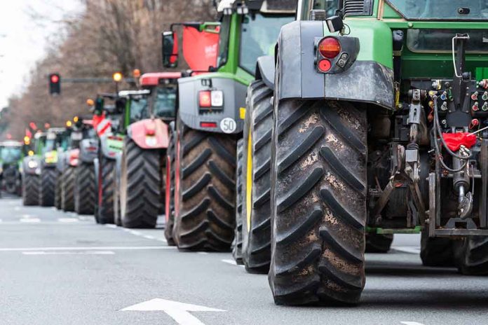 2134418091 featured image Tractors lined up on a city street