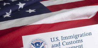 US flag behind Homeland Security document with logo