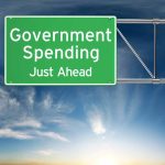 Green road sign Government Spending Just Ahead