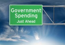 Green road sign Government Spending Just Ahead