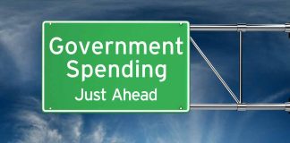Green road sign Government Spending Just Ahead