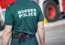 Person in Border Police uniform standing outdoors