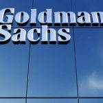 Goldman Sachs sign on glass building facade