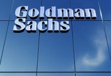 Goldman Sachs sign on glass building facade