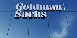 Goldman Sachs sign on glass building facade