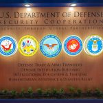 U.S. Department of Defense Security Cooperation display with logos