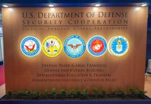 U.S. Department of Defense Security Cooperation display with logos