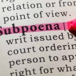 "Subpoena" highlighted in pink in a dictionary.