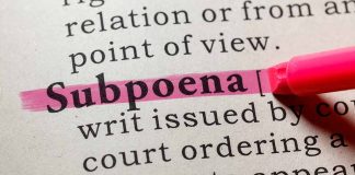 "Subpoena" highlighted in pink in a dictionary.