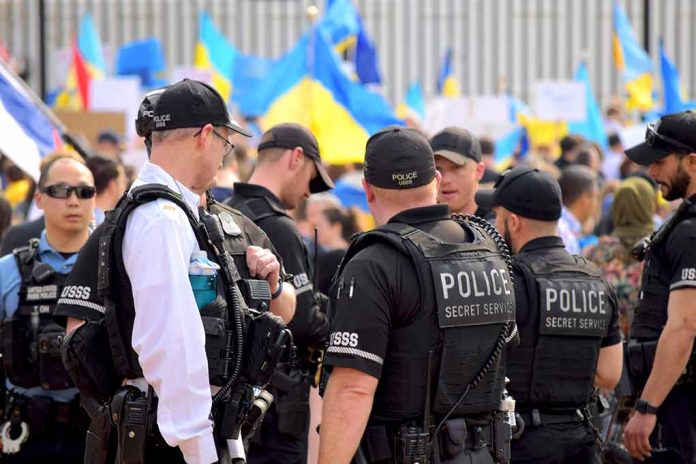 2132863557 featured image Police officers gathered near a crowd with flags