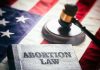 Book titled Abortion Law gavel American flag background