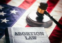 Book titled Abortion Law gavel American flag background