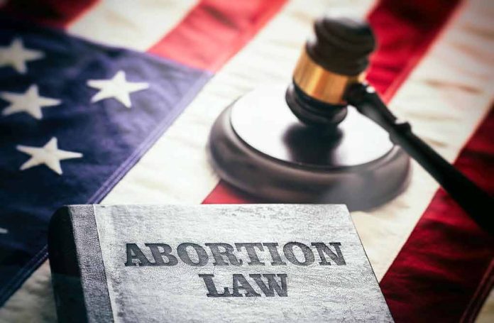 2182069301 featured image Book titled Abortion Law gavel American flag background