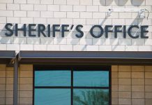 Sheriffs Office sign on brick building faade