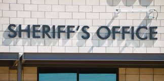 Sheriffs Office sign on brick building faade