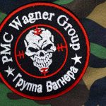 PMC Wagner Group patch on camouflage background.