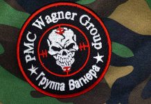 PMC Wagner Group patch on camouflage background.